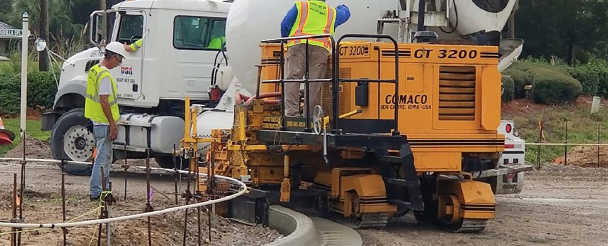 concrete truck and construction workers for US 98 widening